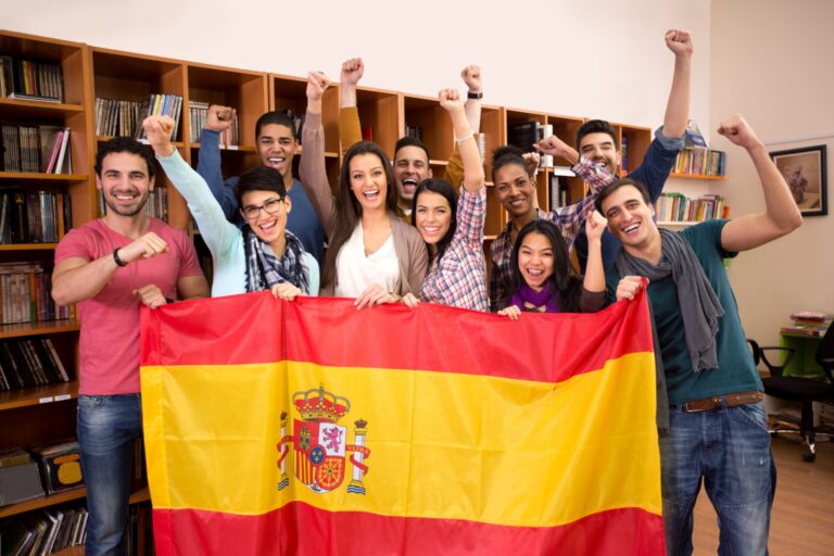 Diverse students celebrating with a Spanish flag